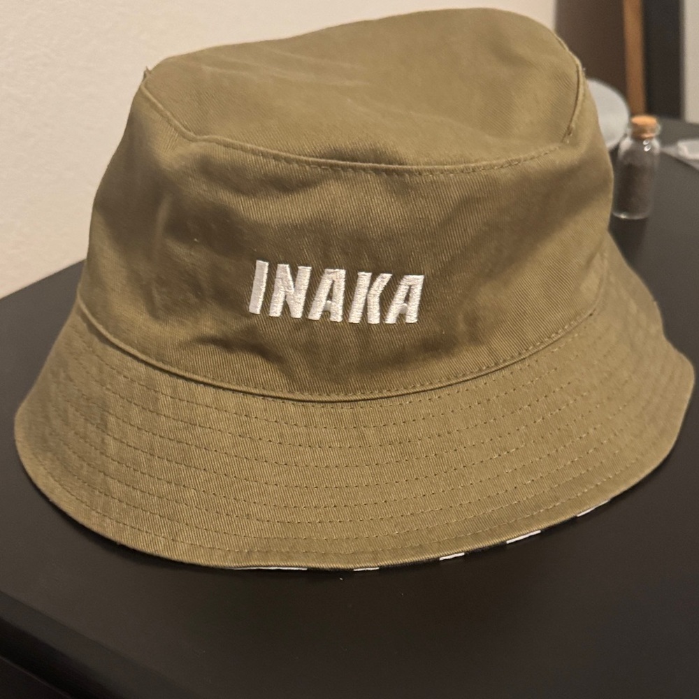 Inaka Olive Bucket Hat reversible zebra print.  Unisex and like new. Used once!